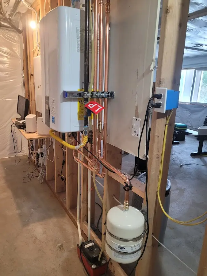 Licensed plumber repairing a kitchen sink in Sterling